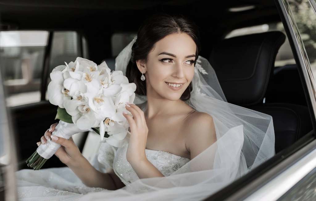 bride in a limousine bridal car