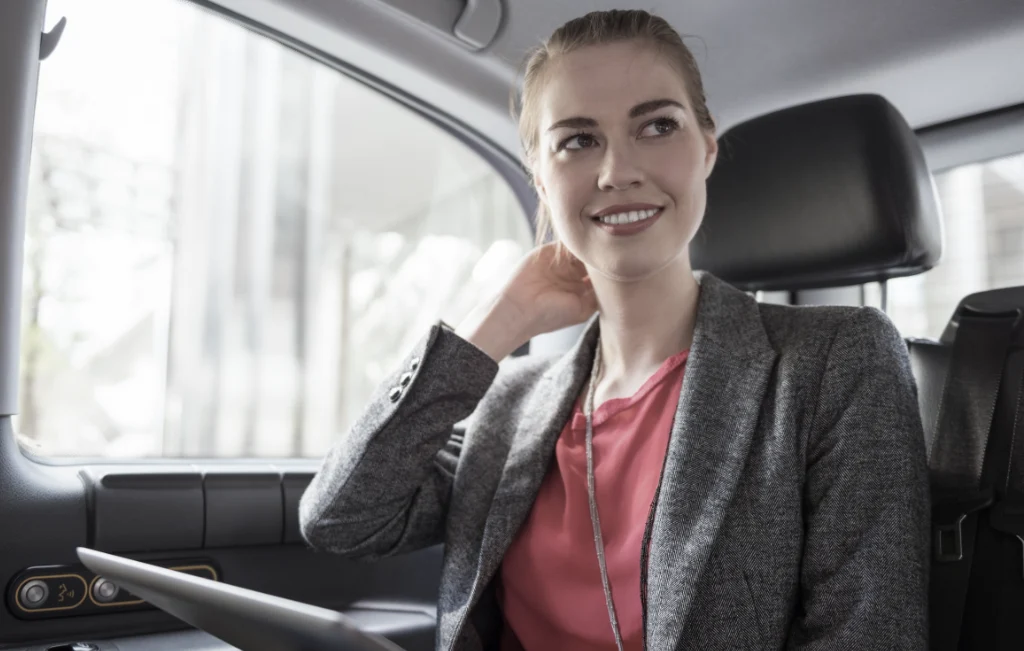 airport transfer client enjoying her ride